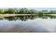 Calm pond surrounded by mature trees at 19837 Lonesome Pine Dr, Land O Lakes, FL 34638