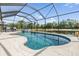 Sparkling screened-in pool with serene pond views and inviting poolside seating at 19837 Lonesome Pine Dr, Land O Lakes, FL 34638