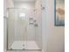 Modern tiled shower with glass door and a built-in niche at 19837 Lonesome Pine Dr, Land O Lakes, FL 34638
