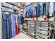 Organized walk-in closet with multiple shelves and hanging rods at 19837 Lonesome Pine Dr, Land O Lakes, FL 34638
