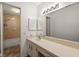 This bathroom has a tiled shower and single sink vanity at 200 Country Club Dr # 906, Largo, FL 33771