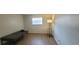 Bedroom featuring wood floors, a window and a floor lamp at 200 Country Club Dr # 906, Largo, FL 33771