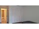 This bedroom has a closet with a wooden door and plank flooring at 200 Country Club Dr # 906, Largo, FL 33771