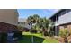 The home features manicured landscaping and mature trees, creating a beautiful and serene outdoor space at 200 Country Club Dr # 906, Largo, FL 33771