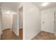 Hallway featuring an entrance to the bathroom, linen closet, and front door at 200 Country Club Dr # 906, Largo, FL 33771