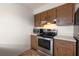 Efficient kitchen layout with stainless steel appliances and ample cabinet storage at 200 Country Club Dr # 906, Largo, FL 33771