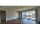 Living room featuring a sliding glass door with a view of the outside at 200 Country Club Dr # 906, Largo, FL 33771