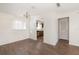 Bright living room with wood floors and an open view to the kitchen at 200 Country Club Dr # 906, Largo, FL 33771