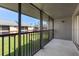 Relax on this screened patio with views of the community at 200 Country Club Dr # 906, Largo, FL 33771