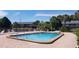 Sparkling community pool with surrounding lounge chairs, perfect for relaxation and enjoying the Florida sunshine at 200 Country Club Dr # 906, Largo, FL 33771