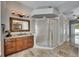 Bathroom with tiled floor, shower, and vanity with a mirror at 2010 Rutherford Dr, Dover, FL 33527