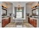 Luxurious bathroom with double vanities, a large soaking tub, and decorative lighting at 2010 Rutherford Dr, Dover, FL 33527