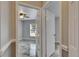 View into the Primary bedroom with tiled floors, fan and neutral decor at 2010 Rutherford Dr, Dover, FL 33527