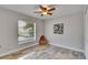 Bright bedroom features a window and ceiling fan, offering a comfortable living space at 2010 Rutherford Dr, Dover, FL 33527