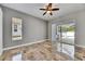 A spacious bedroom with tiled floor and a sliding glass door leading to the pool area at 2010 Rutherford Dr, Dover, FL 33527