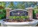 Stone entrance sign for Ridge Crest neighborhood featuring well-maintained landscaping at 2010 Rutherford Dr, Dover, FL 33527