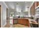 Open-concept kitchen with stainless steel appliances, seamless transition to the living area, with pool in view at 2010 Rutherford Dr, Dover, FL 33527