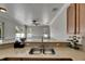 Bright kitchen featuring stainless steel sink, countertop decor, and clear view to the spacious living area and pool at 2010 Rutherford Dr, Dover, FL 33527