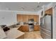 Kitchen featuring stainless steel appliances, wooden cabinets, and spacious countertops at 2010 Rutherford Dr, Dover, FL 33527