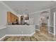 Open kitchen with stainless steel refrigerator, wooden cabinets, and extended countertops at 2010 Rutherford Dr, Dover, FL 33527