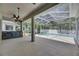 The screened lanai features a pool and outdoor bar area perfect for entertaining and relaxation at 2010 Rutherford Dr, Dover, FL 33527
