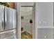 Walk-in pantry features wire shelving, stainless steel refrigerator on the outside at 2010 Rutherford Dr, Dover, FL 33527