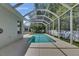 Screen-enclosed pool with deck and view of yard space at 2010 Rutherford Dr, Dover, FL 33527