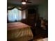 Bedroom with a bed, window, television, dresser, and ceiling fan offering a comfortable space at 2101 Sunset Point Rd # 2305, Clearwater, FL 33765
