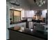 Modern kitchen with stainless steel appliances, black countertops, and white cabinetry at 2101 Sunset Point Rd # 2305, Clearwater, FL 33765