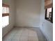 An additional bonus room with windows, tiled floors, and roll up shades for privacy at 2101 Sunset Point Rd # 2305, Clearwater, FL 33765