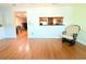 Inviting living room featuring beautiful flooring and an open layout with kitchen access at 2211 Harrison Dr, Holiday, FL 34691