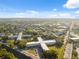 Expansive aerial view showcases the community buildings, surrounded by lush landscaping and serene views at 2221 Swedish Dr # 55, Clearwater, FL 33763