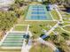 Aerial shot features tennis and shuffleboard courts and amenities at 2221 Swedish Dr # 55, Clearwater, FL 33763