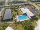 An aerial view of a community pool and solar panel system at 2221 Swedish Dr # 55, Clearwater, FL 33763