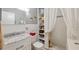 Updated bathroom with white subway tile, vanity with marble countertop, and a shower behind a curtain at 2221 Swedish Dr # 55, Clearwater, FL 33763