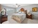Serene bedroom featuring wood furniture, a soft quilt on the bed, neutral walls, and shuttered windows at 2221 Swedish Dr # 55, Clearwater, FL 33763