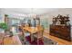 Dining room features wood floors, a chandelier, and a mirrored wall enhancing spaciousness at 2221 Swedish Dr # 55, Clearwater, FL 33763