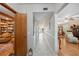 Hallway boasts neutral colors and tile floors, leading to various rooms with unique designs and decor at 2221 Swedish Dr # 55, Clearwater, FL 33763