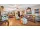 Elegant living room featuring hardwood floors, decorative mirrors, and stylish furnishings at 2221 Swedish Dr # 55, Clearwater, FL 33763
