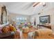 Comfortable living room featuring hardwood floors, soft furnishings, and lots of natural light at 2221 Swedish Dr # 55, Clearwater, FL 33763