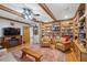Charming living room with a fireplace, built-in shelving, and comfortable seating arrangement at 2221 Swedish Dr # 55, Clearwater, FL 33763