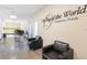 Inviting office area with stylish chairs and a view of the computer stations with natural light at 2221 Swedish Dr # 55, Clearwater, FL 33763