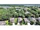 An aerial view captures a neat suburban home with a well-manicured lawn and landscaped yard at 2405 Dakota Rock Dr, Ruskin, FL 33570