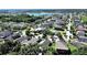Breathtaking aerial shot showcases community near a lake, highlighting the serene and desirable location at 2405 Dakota Rock Dr, Ruskin, FL 33570