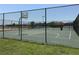 Fenced basketball court features well-maintained surface and hoops, providing a great recreational amenity at 2405 Dakota Rock Dr, Ruskin, FL 33570