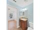 View of a stylish bathroom leading into a bright bedroom, with vanity at 2405 Dakota Rock Dr, Ruskin, FL 33570