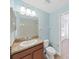 This bathroom features a vanity as well as a view of the bedroom at 2405 Dakota Rock Dr, Ruskin, FL 33570