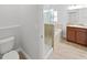 Bathroom showcasing a glass shower, tub, and a toilet at 2405 Dakota Rock Dr, Ruskin, FL 33570