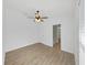 This bedroom features new flooring, a ceiling fan, and bright windows at 2405 Dakota Rock Dr, Ruskin, FL 33570