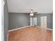 Bedroom boasting grey walls, wood floors, and open doorways to the closet and bathroom at 2405 Dakota Rock Dr, Ruskin, FL 33570